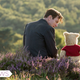 Christopher Robin (Ewan McGregor) and Winnie the Pooh (Jim Cummings) enjoy a moment in Christopher Robin.
